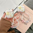 Model holding a Starry Dream Airpods Case Cover, with pastel starry design and beaded strap.