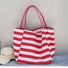 Front view of Stripe Textured Canvas Tote Bag in red, easy for commuting and weekends.
