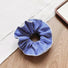Front view of Striped Layered Scrunchie in navy blue and white.
