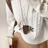 Model wearing Suede Arrow Eyeglass Holder Necklace with Brown Leopard print.