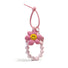 Pink polyester flower bag charm with a yellow smiley face, beaded wristlet, and removable elements.