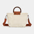 Flat lay of Sunny Straw Woven Bag in white, great for everyday carry and travel.