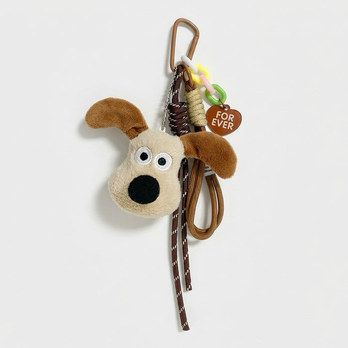 Close-up of the Super Dog bag charm with carabiner, ropes and heart tag.