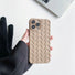 Model holding khaki Textured Woven Case. Intricate geometric woven texture for a sophisticated look.