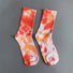Front view of Tie Dye Cotton Socks in red, easy to pack for travel and errands.