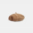 Khaki and beige tie-dye wool beret displayed on a white background.