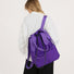 Model styled with the purple ultralight 2-way convertible nylon backpack.