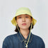 Model wearing cream yellow Ultralight Quick Dry Bucket Hat. Features lightweight tech nylon for rapid drying.
