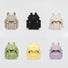 Six polyester Ultralight Urban Daily Backpacks in beige, black, cream, green, yellow, and lavender.