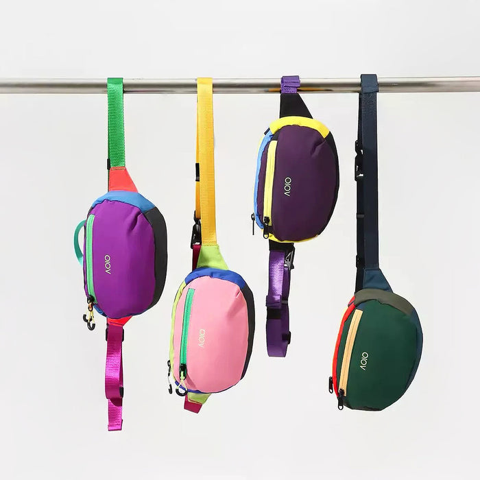 A row of adjustable belt bags hanging, showcasing different webbing strap colors 