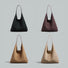 Four-color palette of the vintage suede hobo bag in black, brown, tan, and taupe.