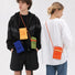 Male and female models wearing the vibrant pleated knit mini crossbody bags in blue, orange, yellow, and green.