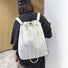 A model wearing the white water-resistant backpack, showcasing the comfortable backpack straps for outdoor ease.