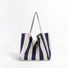 Folded view of Wide Stripe Canvas Tote Bag in navy blue, easy for commuting and weekends.