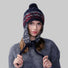 Model wearing navy blue Winter Isle Ear Flap Hat, features classic Nordic motifs in a durable thermal knit.