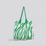 Flat lay of Zebra Print Knitted Tote Bag in white and green, great for everyday carry and travel.