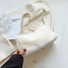 Bolso mini baguette de piel de borrego