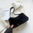 Bolso mini baguette de piel de borrego