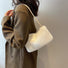 Bolso mini baguette de piel de borrego