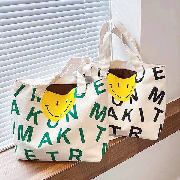 Borsa tote in tela con faccina sorridente