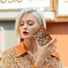 Model holding Bohemia Small Wallet, great for daily carry and travel.