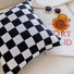 Side view of Checkerboard Pillow Cover in black, showcasing the pattern detail.