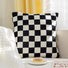 Close-up of Checkerboard Pillow Cover in black, ideal for seasonal styling .