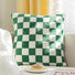 Flat lay of Checkerboard Pillow Cover in green, great for home decor.