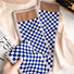 Model wearing a plaid satin scarf Checkerboard Satin Skinny Scarf, great for office layering and commuting.