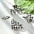 Angled view of  four checkered hair claws in various shopes , ideal for quick updos and ponytails.