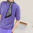 Model wearing a plaid silk scarf in lilac and purple, great for office layering and commuting.