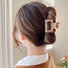Model wearing Color Square Hair Claw in cyan, ideal for quick updos and ponytails.