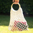 Close-up of Crochet Handbag With Wooden Ring in white, easy for commuting and weekends.