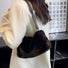 Bolso mini baguette de piel de borrego