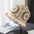 Front view of beige Floral Crochet Hat. Classic elegant knit designed for a comfortable, skin-friendly fit.