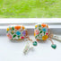 Angled view of  two sizes of Flowers AirPods Case Covers,  easy to carry for commutes and errands.