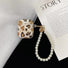 Angled view of Leopard Print AirPods Case Cove with pearl string, easy to carry for commutes and errands.