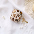 Angled view of Leopard Print AirPods Case Cover with shell charm, great for daily protection and travel.