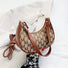 Close-up of Monogram Crescent Shoulder Bag in brown, great for everyday carry and travel.