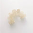 Flat lay of Moon Hair Claw in white, great for everyday styling and gifting.