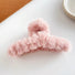 Angled view of Multicolor Plush Hair Claw in pink, great for everyday styling and gifting.