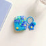 Angled view of blue Oil Painting Flower AirPods Case Cover, easy to carry.