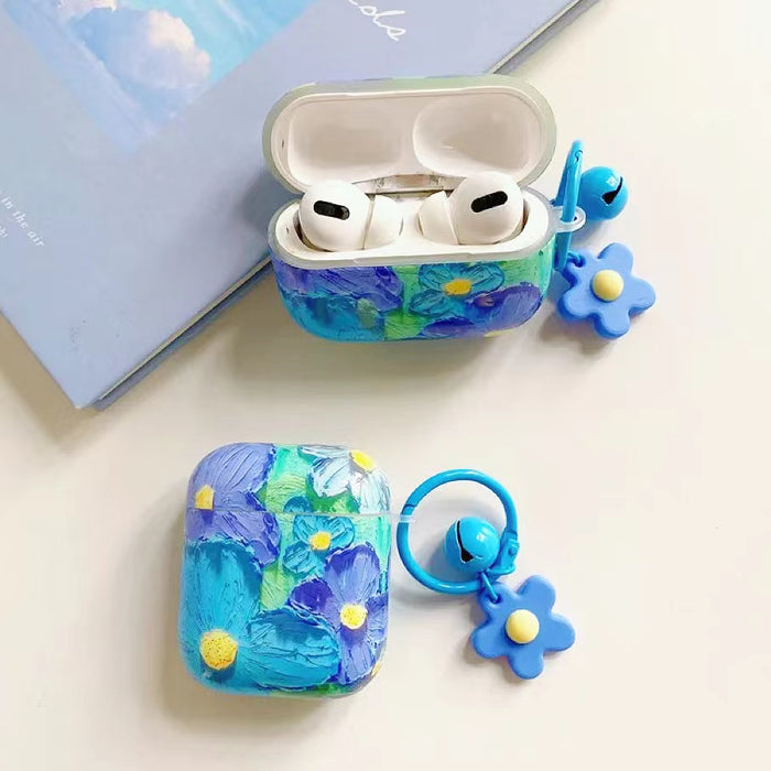 Two Silicone AirPods cases with blue and green oil painting flower design, featuring a blue flower charm.