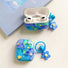 Two Silicone AirPods cases with blue and green oil painting flower design, featuring a blue flower charm.