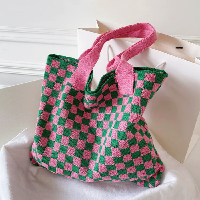 Large pink and green checkered knitted tote bag featuring a soft, thick woven texture.