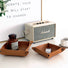 Two brown PU leather trays, one small and one medium, with snap corners, on a white surface storage.