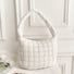 Front view of white puffy shoulder bag on a clean background.