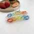 Angled view of Rainbow hair claw , ideal for quick updos and ponytails.