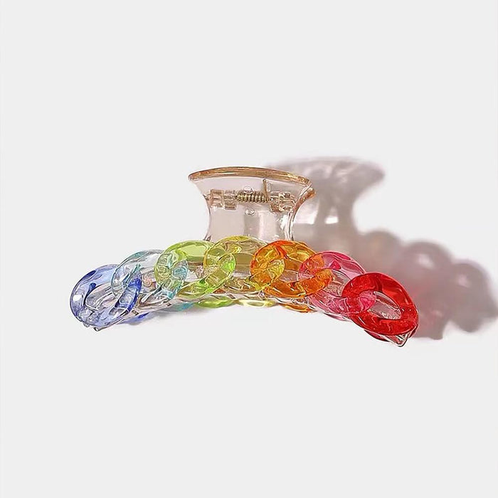 Front view of Clear acrylic hair claw with rainbow-colored.