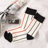 Close-up of Red Stripe Socks, easy to pack for travel and errands.